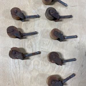 8 casters: wood wheels, metal shaft